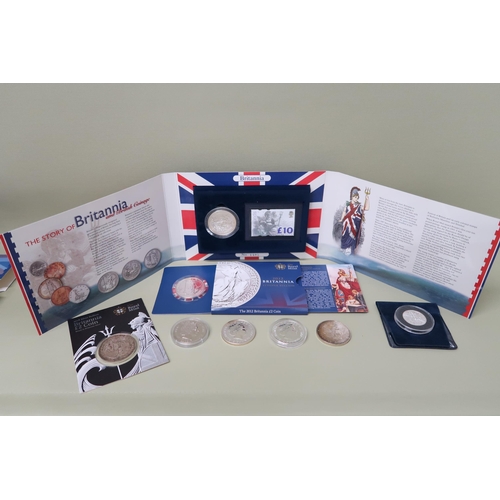 426 - Seven pure silver proof coins and a Britannia two pound sterling silver bullion coin and a ten pound... 