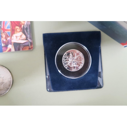 426 - Seven pure silver proof coins and a Britannia two pound sterling silver bullion coin and a ten pound... 