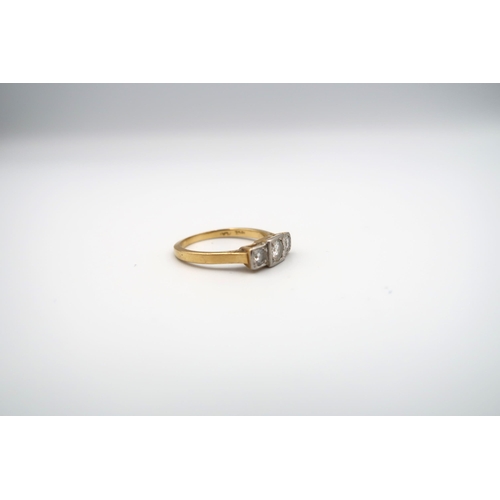 45 - A brilliant cut diamond three stone ring. Estimated total diamond weight 0.50ct. Estimated H/I colou... 