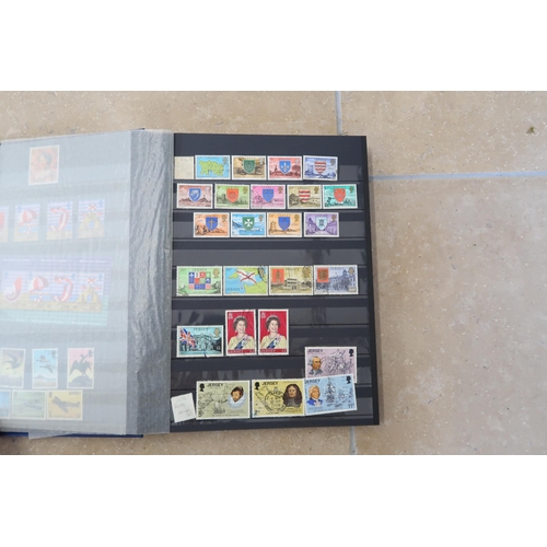 494 - Five stamp albums including Jersey circa 1990's, Guernsey and Alderney, Great Britain circa 1990s, W... 