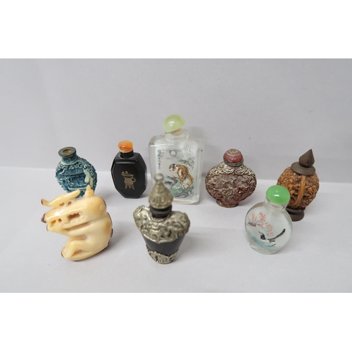 497 - Seven Oriental design perfume bottles, one glass decorated with a tiger amongst foliage with script ... 