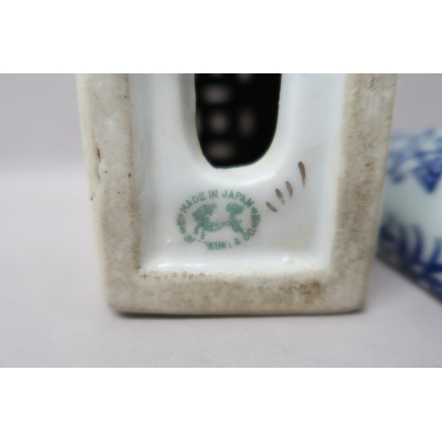 515 - A Japanese porcelain incense holder, 13cm x 14cm high x 6cm, and a blue and white wall pocket decora... 