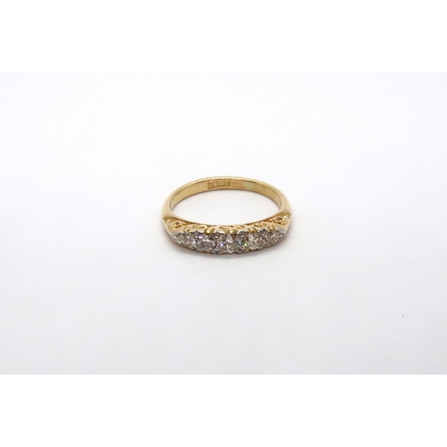 60 - An 18ct yellow gold Edwardian 5 stone diamond ring, diamonds are well matched, head size approx 16mm... 