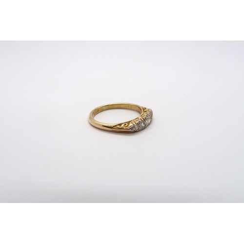 60 - An 18ct yellow gold Edwardian 5 stone diamond ring, diamonds are well matched, head size approx 16mm... 