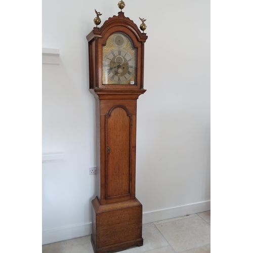 612 - An 8 day Grandfather clock with a brass dial with a plaque for Hanson London, in an oak case with we... 