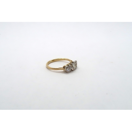 62 - A three stone diamond and yellow metal ring, estimated I/J colour SI1- SI2 clarity, approx 0.75ct, c... 