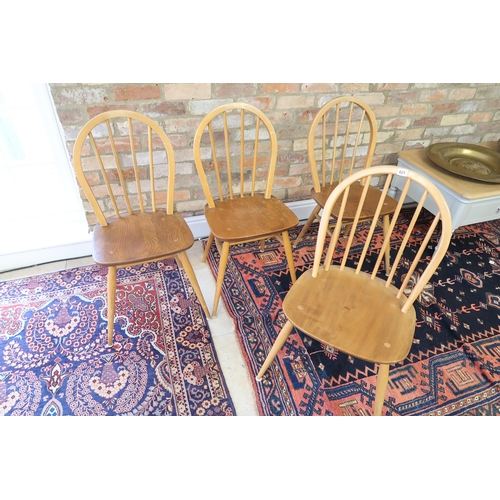 621 - A set of four light Ercol dining chairs