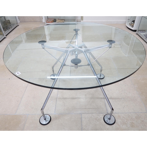 623 - A Norman Foster circular glass topped table with chrome legs - Diameter 120cm x Height 75cm