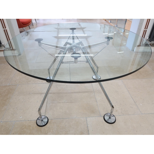 623 - A Norman Foster circular glass topped table with chrome legs - Diameter 120cm x Height 75cm