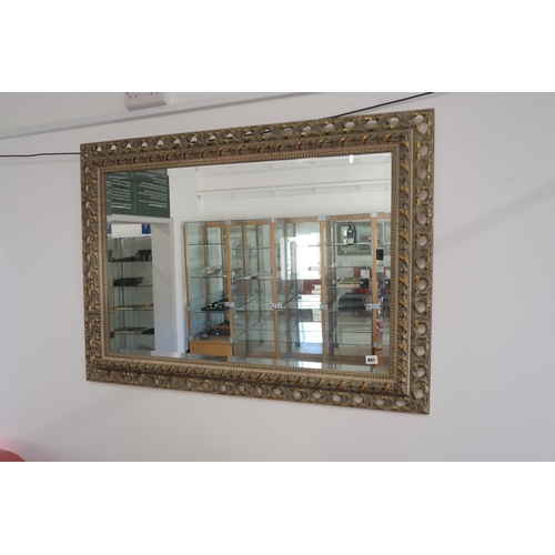 A good quality decorative mirror with bevelled edged glass, in good condition