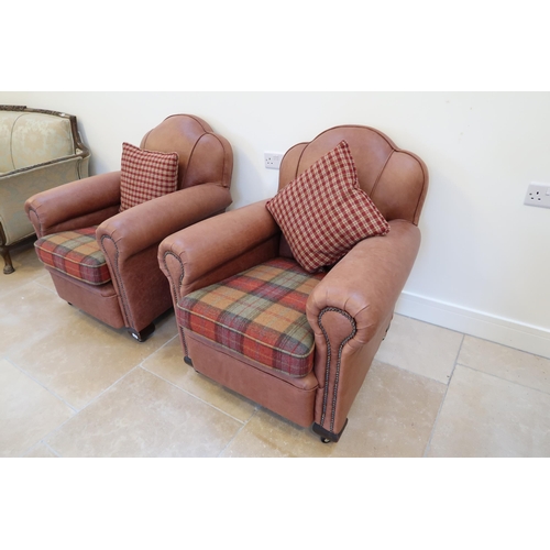 644 - A pair of 1920s Art Deco armchairs recently recovered in leather and in nice condition