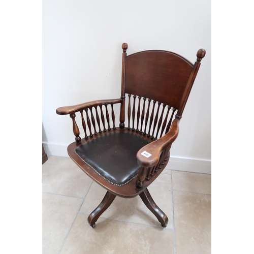 646 - An early 20th century mahogany framed revolving desk chair