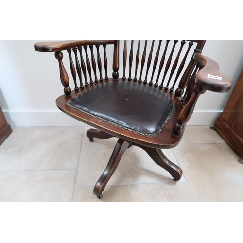 646 - An early 20th century mahogany framed revolving desk chair