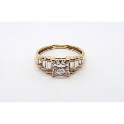 65 - A 9ct yellow gold square cut topaz ring with baguette cut shoulders, head size approx 19mm x 8mm, si... 