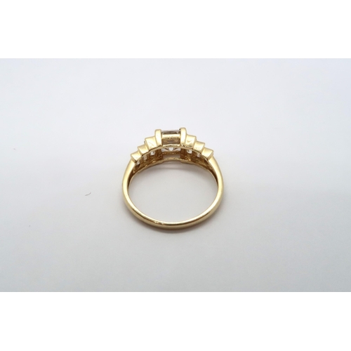 65 - A 9ct yellow gold square cut topaz ring with baguette cut shoulders, head size approx 19mm x 8mm, si... 