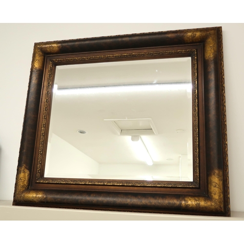 659 - A modern mirror with bevelled edged glass - 84cm x 74cm