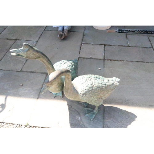 690 - A pair of bronze geese - Largest Height 74cm x Length 60cm