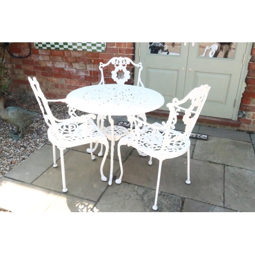 691 - A cast iron garden table and three chairs - Diameter 81.5cm x Height 68cm