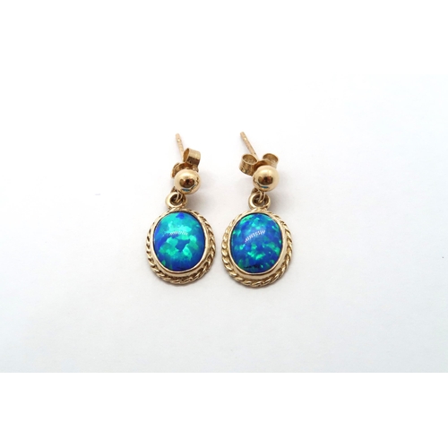 77 - A 9ct yellow gold opal earrings, head size including ball mounts 20mm x 11mm