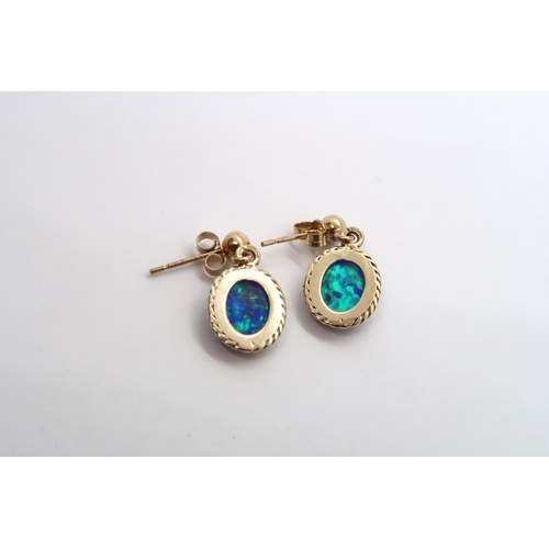 77 - A 9ct yellow gold opal earrings, head size including ball mounts 20mm x 11mm