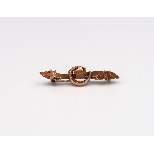 78 - An 18ct yellow gold (tested) tie pin with jade and pearl together with a 9ct rose gold brooch