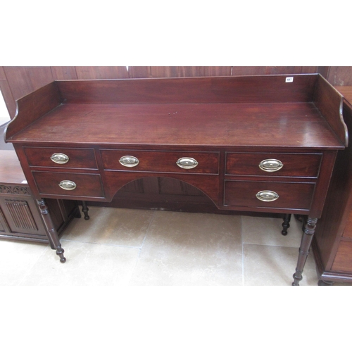 687 - A Victorian mahogany five drawer double washstand/desk on turned legs with upper gallery - Width 139... 