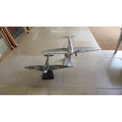 492A - A large scale model of a Spitfire and one smaller painted example - size nose to tail 60cm and wings... 