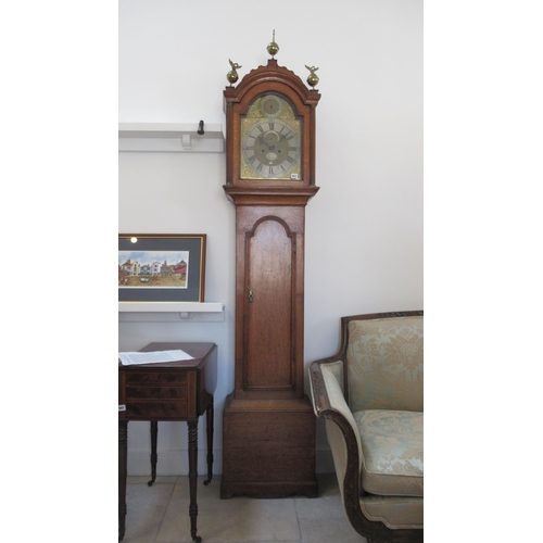 612 - An 8 day Grandfather clock with a brass dial with a plaque for Hanson London, in an oak case with we... 