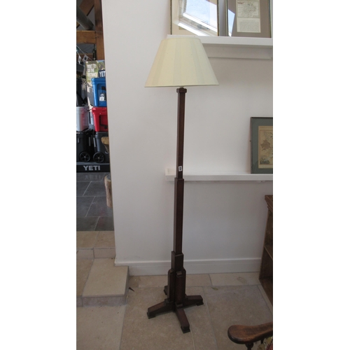 632 - An Art Deco oak standard lamp and shade in working order