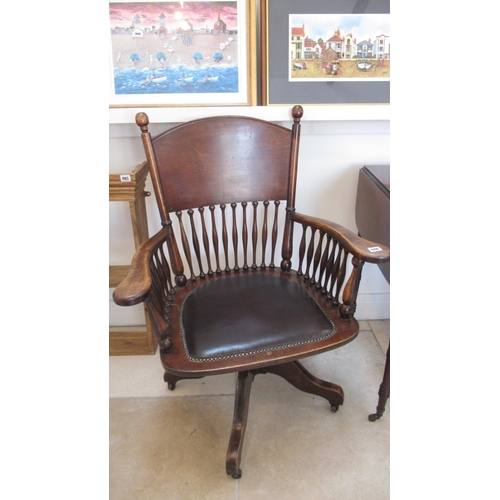 646 - An early 20th century mahogany framed revolving desk chair