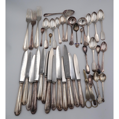 387 - A selection of silver plated items including flatware, tea pot, milk, sugar, peppers etc