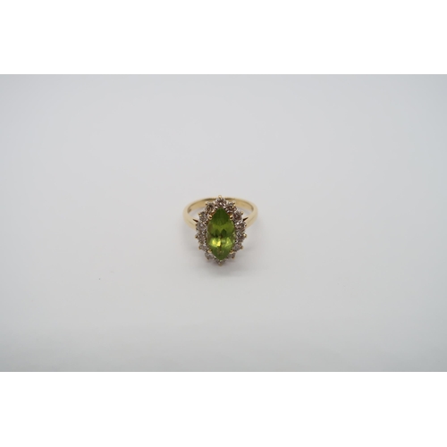 99 - An 18ct yellow gold marquis cut peridot and diamond ring, peridot is good colour, diamonds bright an... 