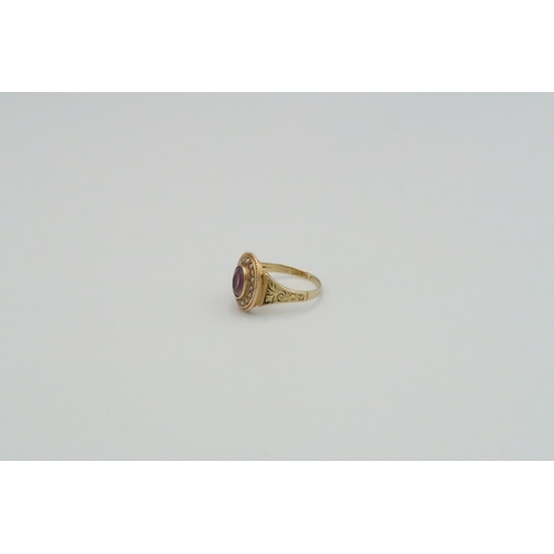 1 - A 15ct yellow gold dress ring, oval cut amethyst surrounded with pearls