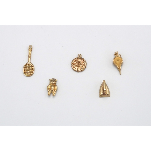 107 - Five 9ct gold charms - approx weight 3.7 grams