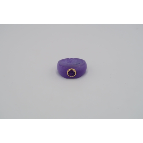 122 - An amethyst ring size T 1/2. Stamped 14K. Weight 8.22grams. An amethyst panel bracelet. Tests 14K. W... 