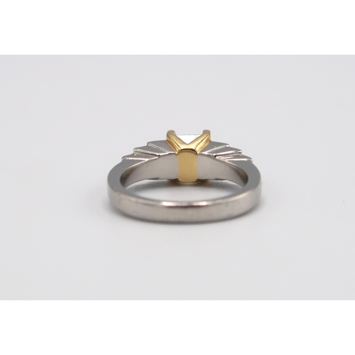 124 - An 18ct gold and platinum ring designed as a fancy light yellow princess cut diamond with three grad... 