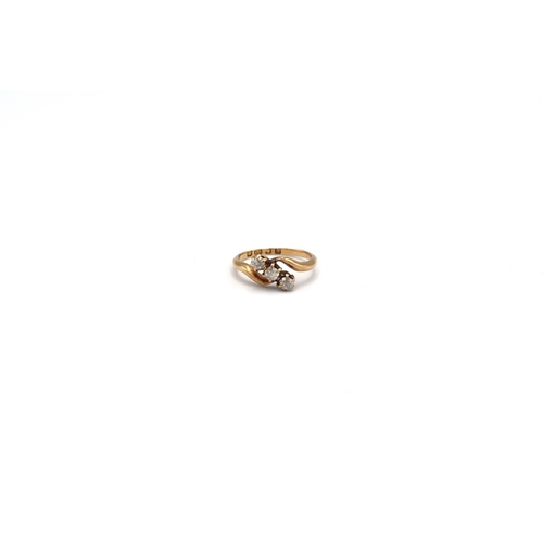 143 - An 18ct old cut diamond three stone crossover ring. Size M. Weight approx 2.79 grams