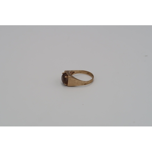 145 - Two 9ct gold rings to include and oval onyx signet ring and a smokey quartz single stone. Size P1/2 ... 