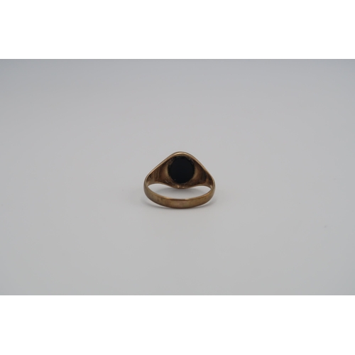 145 - Two 9ct gold rings to include and oval onyx signet ring and a smokey quartz single stone. Size P1/2 ... 