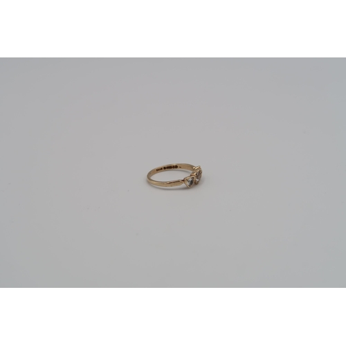 15 - A 9ct three stone ring size L - weight approx 1.61 grams