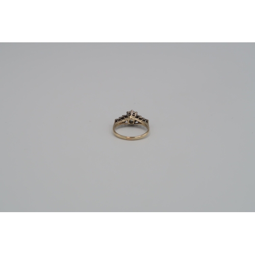 166 - A 9ct and 18ct Yellow Gold Diamond ring, Centre stone approx. 1.25ct with six baguette cut diamonds ... 