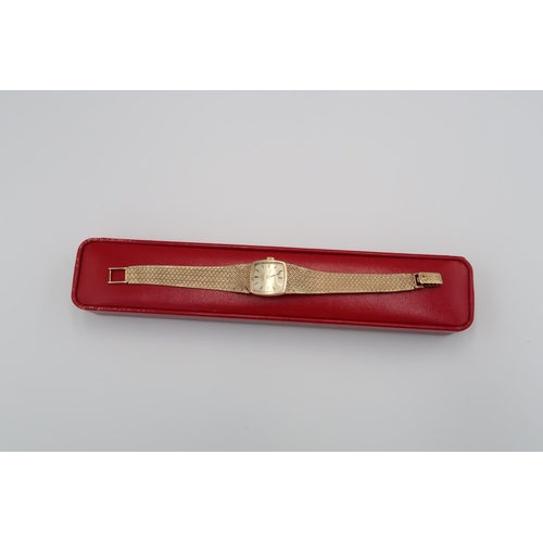 267 - A ladies 9ct yellow gold Omega De Ville bracelet wristwatch gold coloured dial with baton markers, d... 