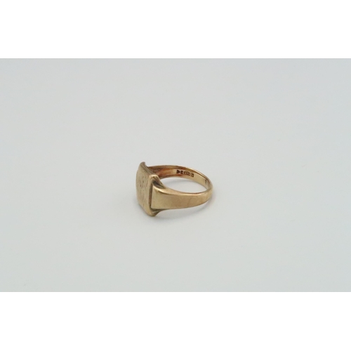 28 - A 9ct yellow gold signet ring, Size U 1/2 - weight approx 8.25 grams