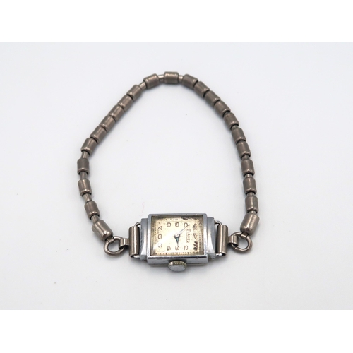 311 - Five ladies cocktail watches including one silver cased