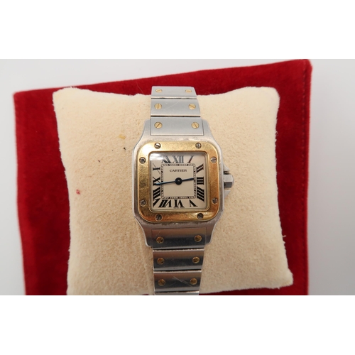 321 - A ladies Cartier Santos 1567. Steel and gold. Good condition, requires a new battery. Weight 64.67