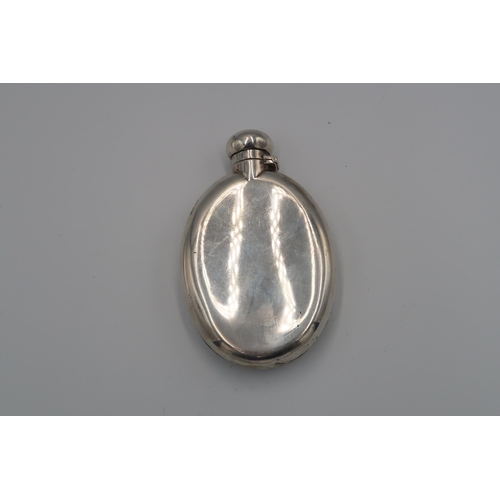 361 - A silver hallmarked hip flask of oval form, A/F, 3.8 troy oz