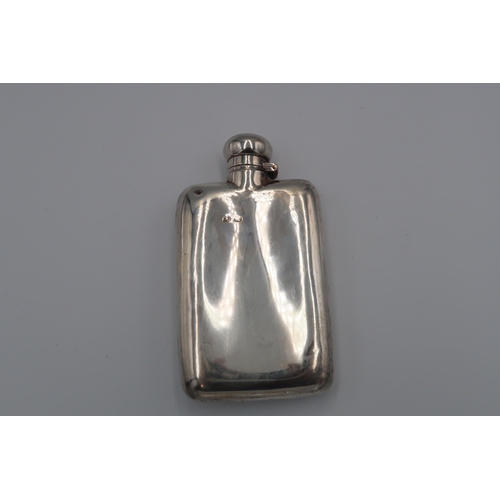 368 - A silver hallmarked hip flask with engraved decoration, 4.64 troy oz