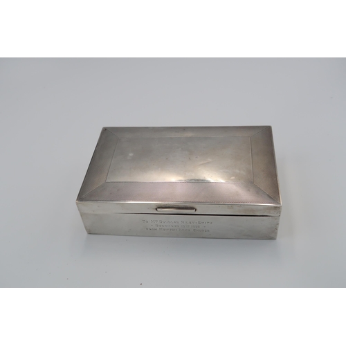 375 - A silver hallmarked cigarette box, London 1935, with engine turned decoration