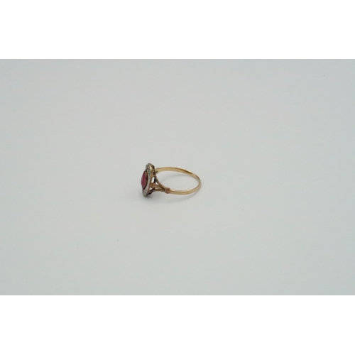 40 - Three rings to include an oval ruby and diamond panel ring, size N, weight approx 2.07 grams. An ova... 