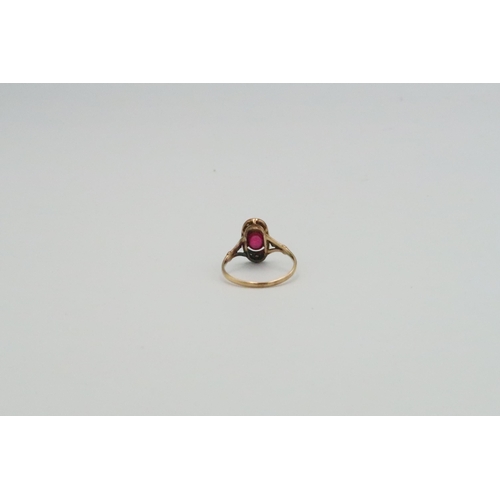 40 - Three rings to include an oval ruby and diamond panel ring, size N, weight approx 2.07 grams. An ova... 